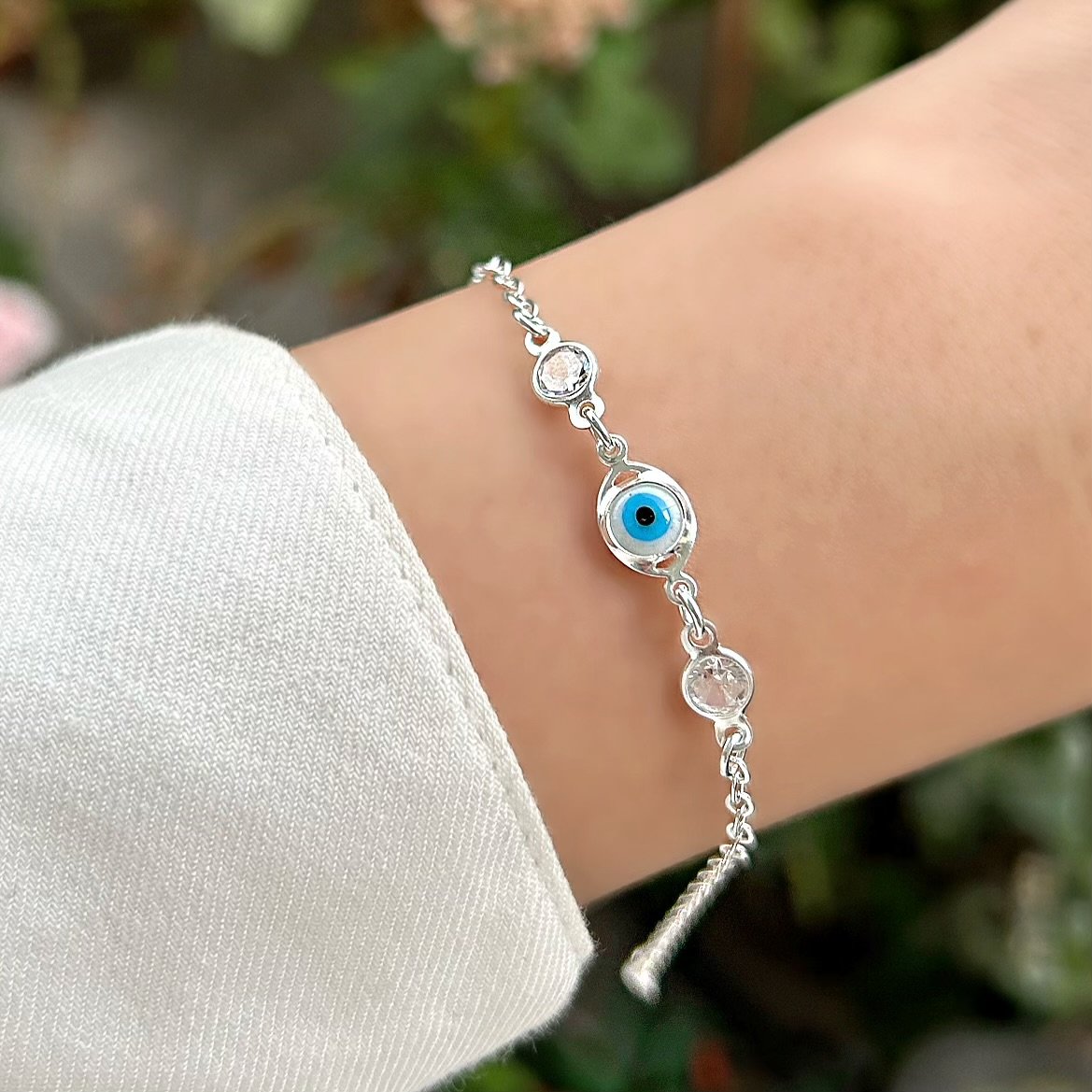 0047425 - PULSEIRA PRATA BATIDINHA DUAS ZIRCONIAS REDONDAS OLHO GREGO OVAL